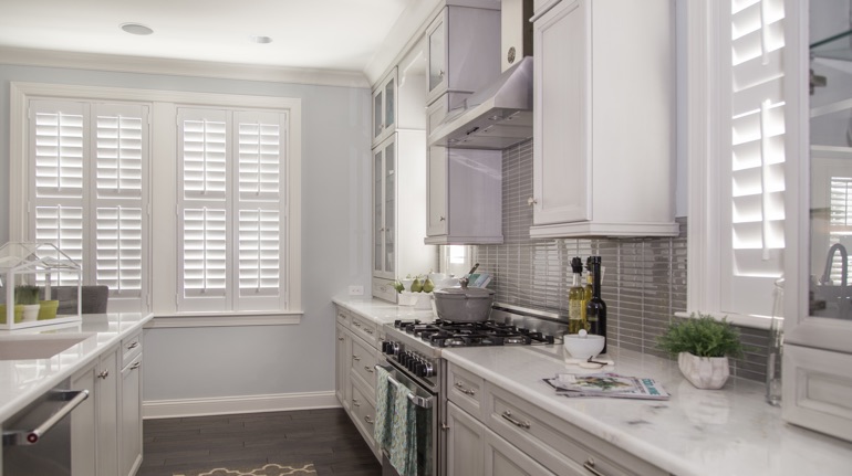 White shutters in Destin kitchen with white cabinets.